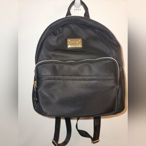 Calvin Klein Black Backpack with Gold Zippers and Smooth Finish
